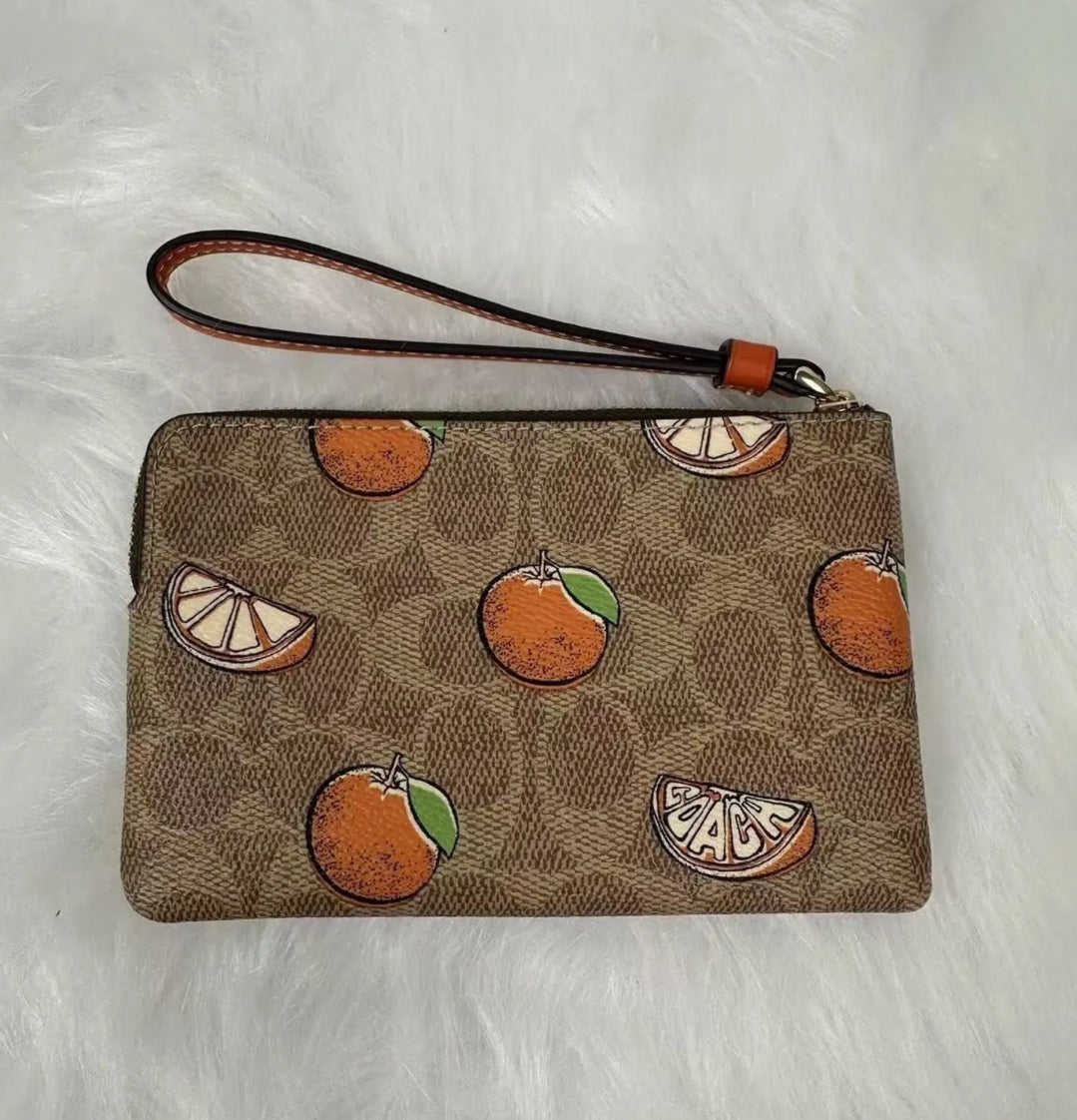 COACH ORANGES WRISTLET