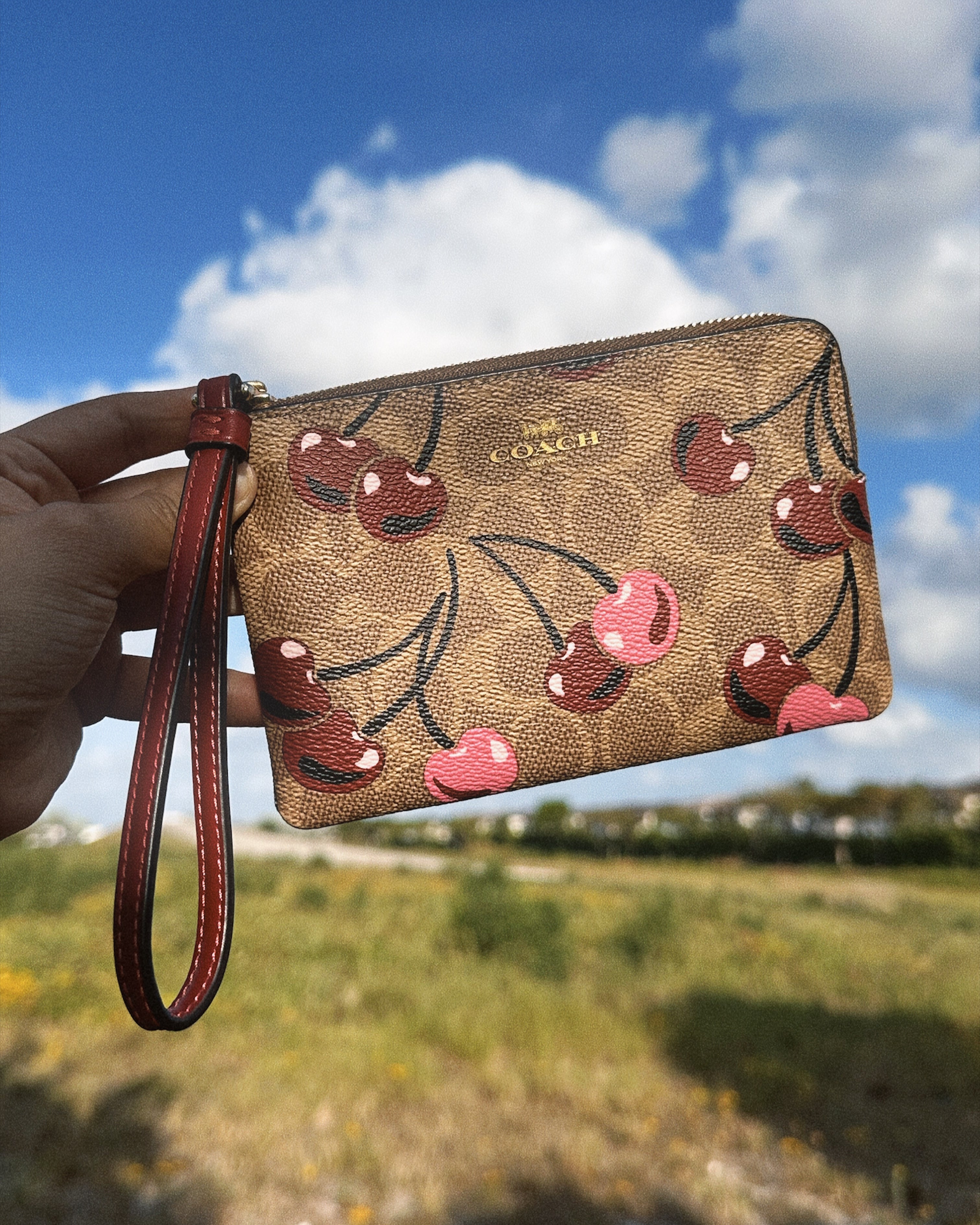 COACH CHERRY WRISTLET