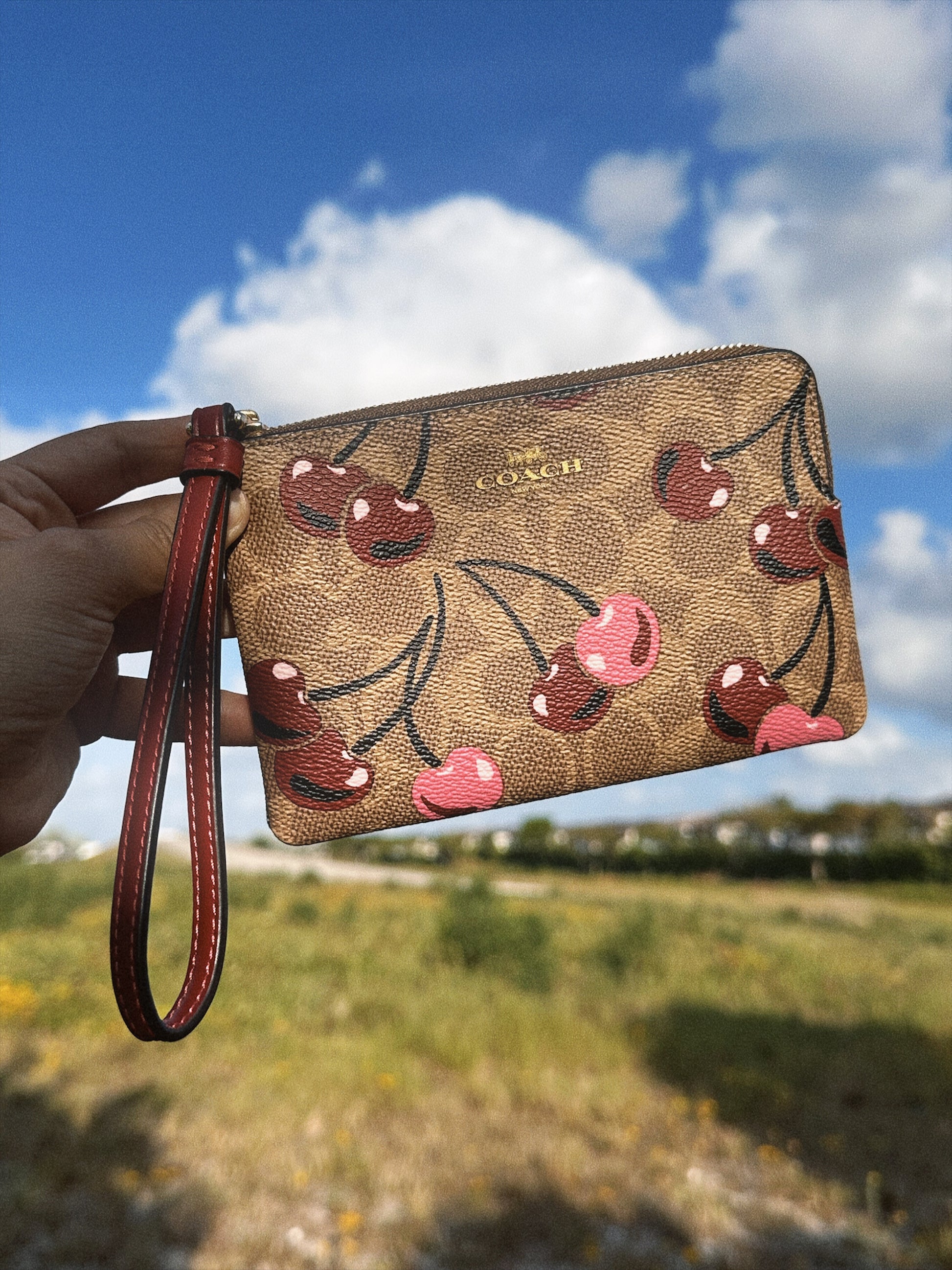 COACH CHERRY WRISTLET